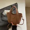 Bolsa de Mão Texturizada de Luxo Modelo Saco para Mulheres 2026 Nova Tendência de Nicho Bolsa de Ombro Elegante para o Dia a Dia Bolsa Transversal