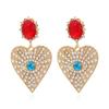 Pendientes exagerados creativos retro de aleación con forma de corazón de diamante con forma de ojo de diablo, pendientes de amor lindos distintivos europeos y americanos