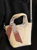Bolsa Pequena para Mãe de Verão Feminina 2025 Nova Moda Bolsinha Feminina Casual Bolsinha de Ombro Estilo Western Bolsinha Transversal de Balde