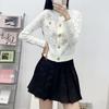 Cárdigan de punto fino de manga larga con cuello redondo, diseño jacquard de estrellas de estilo francés de alta gama para mujer, con botones metálicos