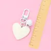 Nuevo llavero Bell love colgante lindo color resina corazón de durazno accesorios pequeño fresco adornos de corazón de durazno