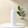Yuzhuang Botella redonda de hombro de PET de 24 dientes para aceite esencial de 300 ml Botella de champú de acción de bomba Envase de botella de plástico vacío para el cuidado del cabello