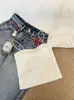 Camisola sin costuras de seda helada de longitud media sin tirantes para mujer con almohadillas en el busto, espalda hermosa, bordes ondulados y diseño anti-exposición