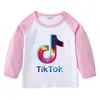 2026 Nueva Camiseta Infantil Transfronteriza de Primavera y Otoño Cuello Redondo Dibujos Animados Manga Larga Camiseta Básica para Niños y Niñas Camiseta de Algodón para Bebé