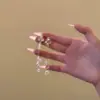 Brincos de tarraxa super etéreos, elegantes e de alta qualidade com zircônia microincrustada para mulheres, design de nicho, brincos de franja longa, brincos de luxo leve atacado