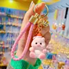 Cartoon Ano Novo Natal chaveiro de animal pequeno feminino fofo moda requintado boneca de resina chaveiro pingente de mochila