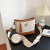 Bolsas femininas populares deste ano 2026 nova tendência moda retrô estampada bolsa transversal tipo balde bolsa de ombro de grande capacidade