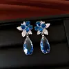 Aretes de plata con mariposa y gota de agua incrustadas de diamantes, sensación de lujo ligero y alta gama, elegantes y versátiles para fiestas, aretes para mujer