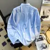 Tendência de moda 2026 camisa azul de manga comprida para homens, verão, única e de nicho, roupas masculinas de alta qualidade, camisa com gola alta desconstruída