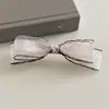 Acessório de Cabelo Elegante Estilo Chanel com Laço de Tela Atmosférico e Presilha Versátil para Primavera