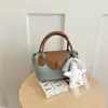 Bolso Nicho Estilo Coreano Chic de Moda Simple Bolso Tote Pequeño para el Viaje Diario Bolso Cruzado Nuevo Estilo 2026