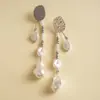 Pendientes de borla de flor de concha blanca transfronterizos europeos y americanos con perlas, pendientes de estilo de corte francés, pendientes ligeros y lujosos con un toque de alta gama