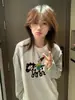 Camiseta de Manga Longa Listrada Contrastante Estilo Ins Doce e Cool para Mulheres Outono Inicial Nova Solta Casual Moda Versátil Gola Redonda Top