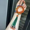 Pulsera y Collar de Múltiples Círculos de Jade Azul Natural y Azul Philippe con Cadena de Lana Colgante y Pieza de Mano para Jugar para Mujeres