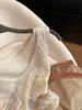 Chaleco de Punto Sin Mangas con Cuello en V Hueco de Avena Falso Dos Piezas para Mujer Verano 2026 Nuevo Estilo Old Money Temperamento Top Adelgazante