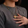 Collar de Plata de Ley S925 Hueco de Trébol de Cuatro Hojas para Mujer, Estilo de Lujo Ligero de Gama Alta con Colgante de Circonita y Calcedonia, Directo de la Fábrica Fuente