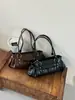 Bolso de Mano de Cuero Suave Color Sólido Lujo Ligero para Mujer 2026 Nuevo de Gama Alta para el Trabajo Transfronterizo Simple Moda Bolso de Hombro Único para el Trabajo