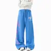 Calça de moletom color block com estampa em espuma, estilo high street americano para homens e mulheres, calça casual solta da moda de outono com uma vibe descontraída, calça elegante de perna larga