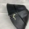 Sombrero femenino otoño e invierno pareja negro todo a juego sombrero de pescador moda coreana cremallera cuero sombrero cubo estilo Hong Kong sombrero de calle moda