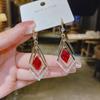 Pendientes de lazo de terciopelo rojo con ambiente de moda, temperamento femenino, flor dulce, borla larga, pendientes Joker al por mayor
