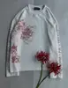 Top de corte solto, gola redonda, nova coleção de primavera, estilo europeu e americano, estética escura, estampa floral, camiseta de manga longa, unissex