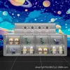 Gabinete de intercambio de regalos de juego de pinball, pared de exhibición de juguetes de moda, gabinete isla de escalera de múltiples niveles, mostrador de caja de tienda de videojuegos popular