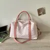 Nova bolsa tote 2026, leve, de grande capacidade, minimalista e estilosa para passeios, oferecendo um look casual único e fashion.