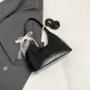 Bolso cubo minimalista de mano, nuevo modelo primavera 2026, alto atractivo estético, bolso de hombro moderno y elegante, bolso cruzado de moda nicho
