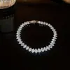 Pulsera Trenzada Hebilla de Herradura Redonda de Circonita Roja Europea y Americana Diseño de Nicho Pulsera Exquisita de Gama Alta para Mujer