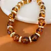 Conjunto de Pulseira Elástica e Colar com Contas Redondas Acrílicas Marmorizadas Vintage Acessórios Modernos Versáteis para Mulheres