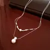 Colar pingente de pérola e zircônia, luxo leve, toque sofisticado, corrente fina para clavícula, design de nicho, acessório versátil