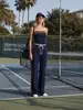 2026 Novo Conjunto Esportivo Casual Duas Peças Feminino Estilo Tênis Europeu e Americano com Listras, Tubinho e Calça de Pernas Largas Solta Cross-Border TK