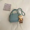 Bolsa de Concha de Mano Minimalista de Nicho Estilo Coreano para Mujer 2026 Nueva Llegada Primavera Elegante Exquisita Versátil Bolso de Hombro Cruzado