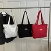 Bolsa Tote de Ombro Casual Versátil Leve e de Grande Capacidade Nova Moda Outono 2026 para Estudantes Universitários que Vão para a Aula