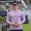 Nova Camiseta Manga Longa Gola Redonda Cor Sólida Esportiva Fitness Muscular Casual ao Ar Livre Corrida Primavera e Verão Top Base