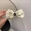 Horquilla de estilo francés con lazo de cuentas de camelia, elegante horquilla estilo Chanel con bola, tocado de cola de caballo alta para mujer