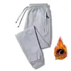 Pantalones gruesos con forro polar para otoño e invierno, nuevos, holgados, combinables, casuales, de moda, para hombre, pantalones deportivos de talla grande con cremallera y bolsillo.