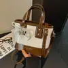 Bolso Tote Pequeño Súper Caliente para Viaje de Trabajo de Mujer 2026 Nuevo Verano Textura Tejida Retro Bolso Cubo de Hombro Único Cruzado