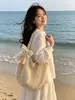 Bolso tejido de gran capacidad, nuevo estilo 2026, diseño de huecos de nicho, bolso de hombro casual, bolsa de mano para ir al trabajo, bolso versátil para mujer