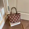 Bolso de cubo casual estilo coreano, nuevo bolso de mano principios de otoño 2026, bolso de hombro y cruzado de moda con lunares único