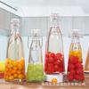 Una botella de vidrio con hebilla Jin sellada, botella para enzimas, botella para bebidas de jugo, botella portátil para alimentación, botella para vino de ciruela, botella para elaboración casera