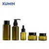 Botellas de Set de Cosméticos Xumin en Stock: Frasco de Crema de Vidrio de 30g, Botella de Loción Ámbar de 100ml, Botella Gotero, Botella de Hidrosol