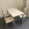 Fabricante directo de mesas y sillas para comedores de comida rápida, muebles de acero-madera-hierro, una mesa con cuatro sillas, para uso doméstico, tiendas de té de leche, cafeterías, restaurantes sencillos, venta al por mayor