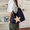 Bolsa de ombro feminina estilo ins coreano com formato de estrela, casual e versátil, de grande capacidade, adequada para lazer, trabalho e deslocamento.