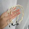 Diadema de perlas de 10 yuanes, tienda de accesorios para el cabello coreanos, tocado en línea, estilo Mori rojo, Joker, diadema antideslizante para lavarse la cara para niñas.