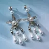 Pendientes de perlas de estrella de mar transfronterizos europeos y americanos, estilo vacacional junto al mar, pendientes de diseñador para mujer, nicho de lujo ligero, pendientes de alta gama