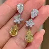 Moda europea y americana temperamento Joker pendientes largos de gota de agua para mujer simples micro-pavimentados pendientes de circonita con diamante amarillo venta al por mayor e2175