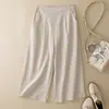 Foto real de los nuevos pantalones casuales de algodón y lino de corte holgado, talla grande, con caída, de tres cuartos y pierna recta, para mujer, colección primavera-verano 2026