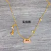 Loja de Ouro Esmalte Rosa Bolsa com Cadeado Lírio do Vale Colar com Franja Corrente Única Dourada Feminina de Luxo Estilo Étnico