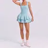 Falda corta de tenis sin espalda estilo europeo y americano, tacto nude, ajustada, anti-exposición para mujer, nueva falda corta transfronteriza para correr al aire libre, fitness, yoga